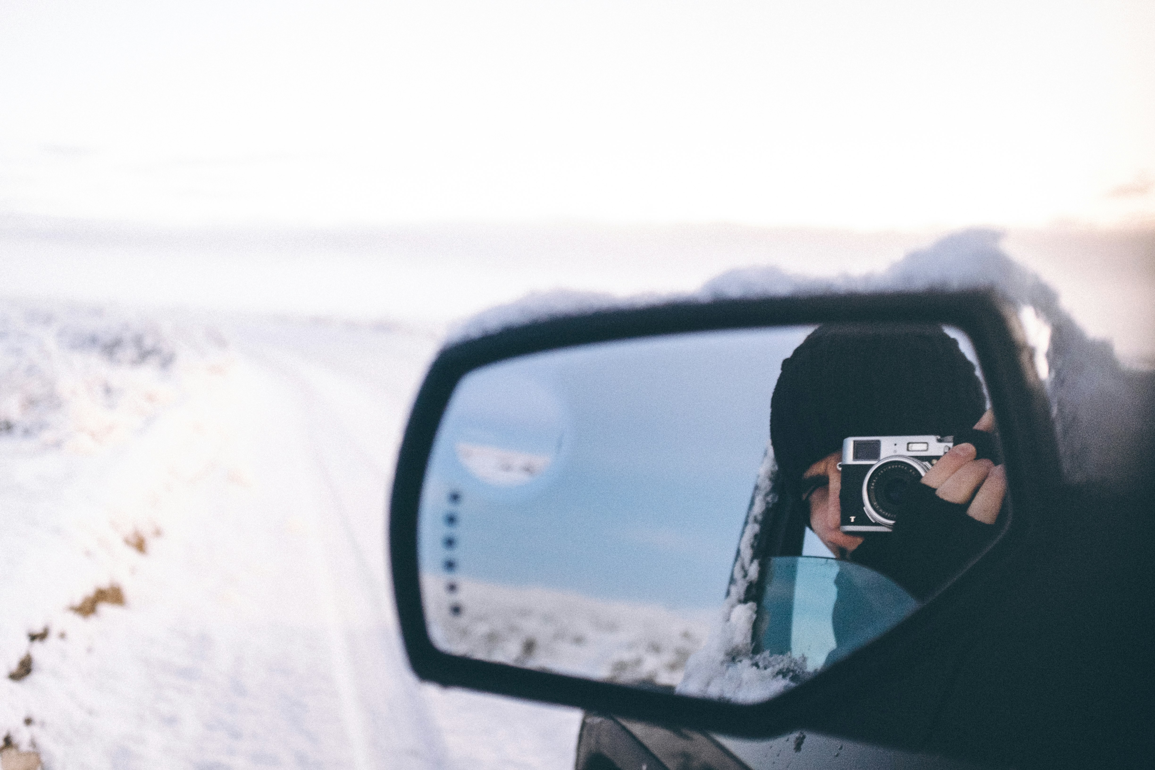 person riding on the vehicle holding camera